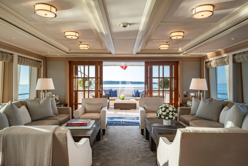 Main Salon - 2026 refit - carpet is now a beautiful Sisal carpet with a refined "coastal feel." New decorative blue pillows with a sophisticated coastal motif